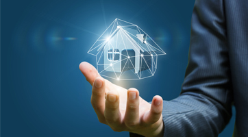 Arm extended with palm facing up with small house surrounded with transparent shield hovering above