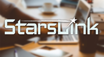 White StarsLink logo with someone using a laptop on a desk in the background
