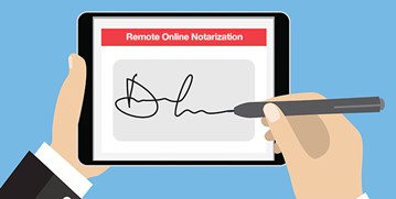 Hands signing a Remote Online Notarization form on an iPad.