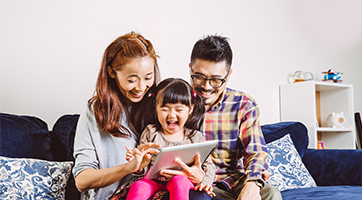 Parents reading with toddler