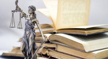 books and lady justice statue